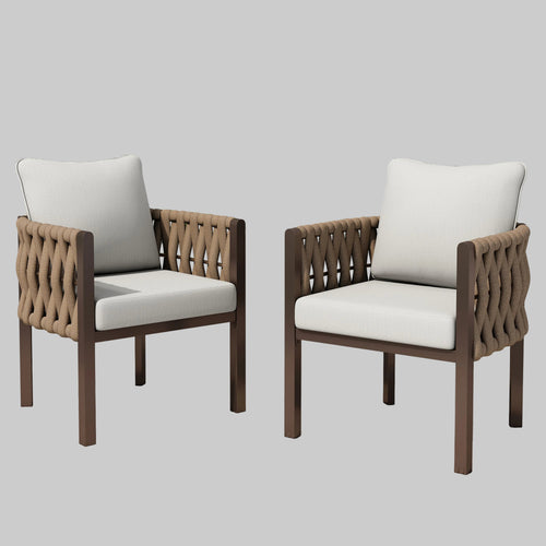 A pair of modern brown metal patio club chairs with light grey cushions and woven rope design on a backyard patio.