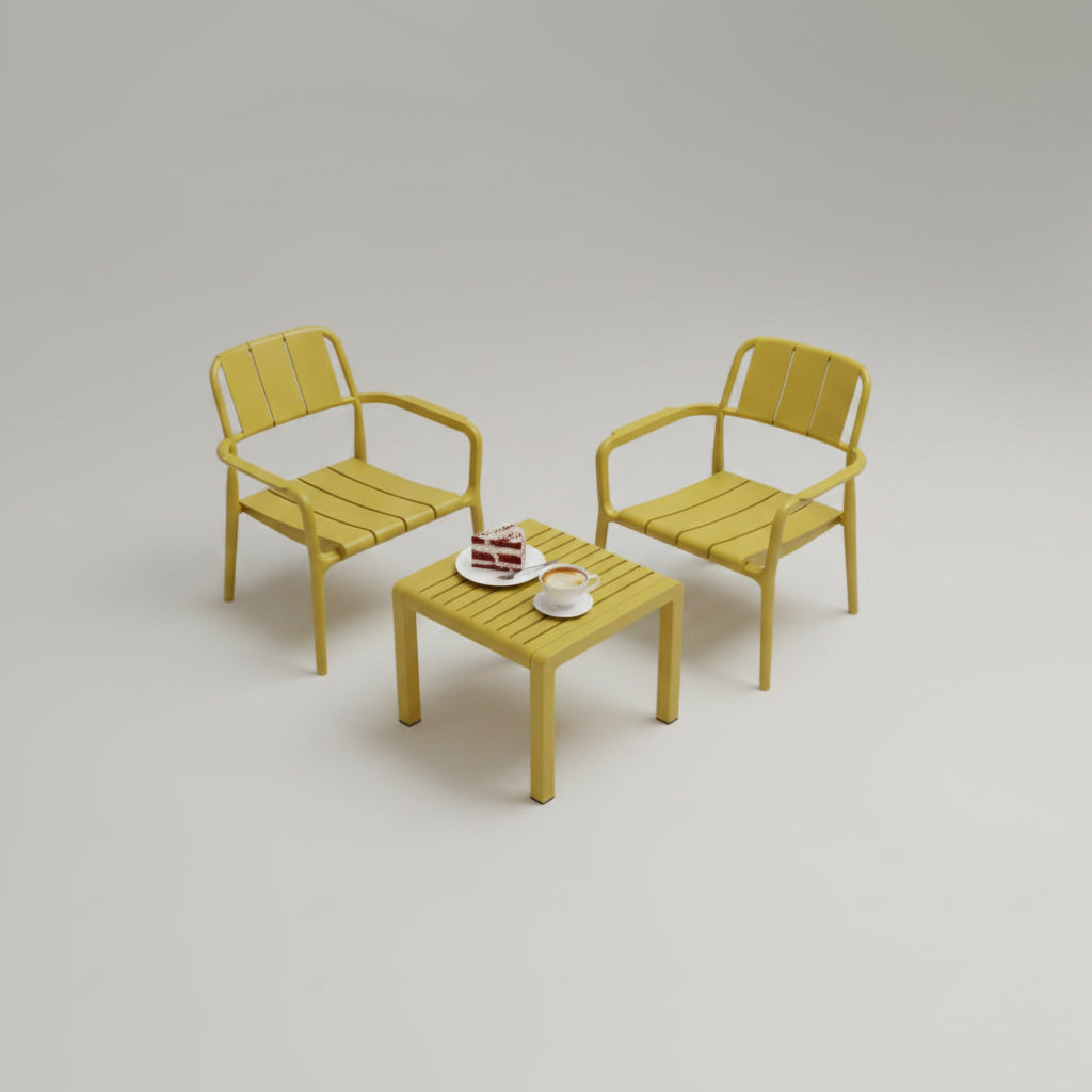 A 3-piece apricot yellow polypropylene bistro furniture set with two modern slatted chairs and a matching coffee table on a sunny apartment balcony.