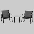 A 3-piece black outdoor courtyard reception set featuring two Textilene fabric chairs and a matching metal frame table on a sunny garden patio.