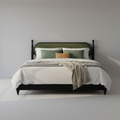 Modern king-size platform bed frame with a sleek black solid wood frame and a plush green upholstered headboard.