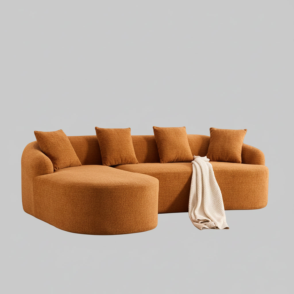 orange compression sectional sofa with chaise lounge upholstered in chenille fabric featuring full sponge cushions and four matching pillows.