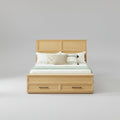 Modern queen-size oak bed frame featuring a 3D geometric headboard and a matching storage bench at the foot of the bed.